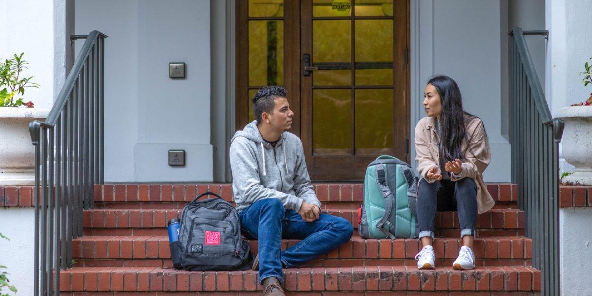 students sitting on steps at SMC