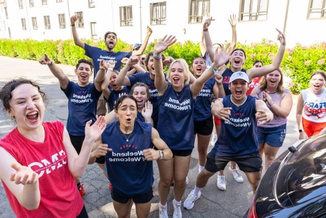 Students cheering wearing shirts that say Weekend of Welcome